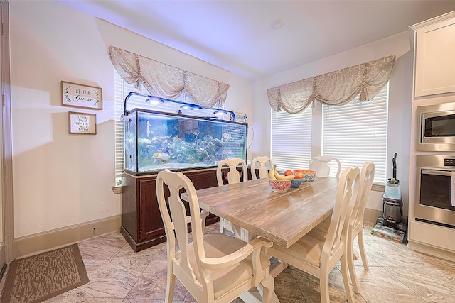 3911 Avalon Ridge Dr, Spring, TX 77386 - dining area featuring baseboards and light marble finish flooring