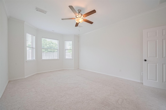 4142 Regal Stone Ln, Sugar Land, TX 77479 - spare room featuring light colored carpet, a ceiling fan, crown molding, and baseboards