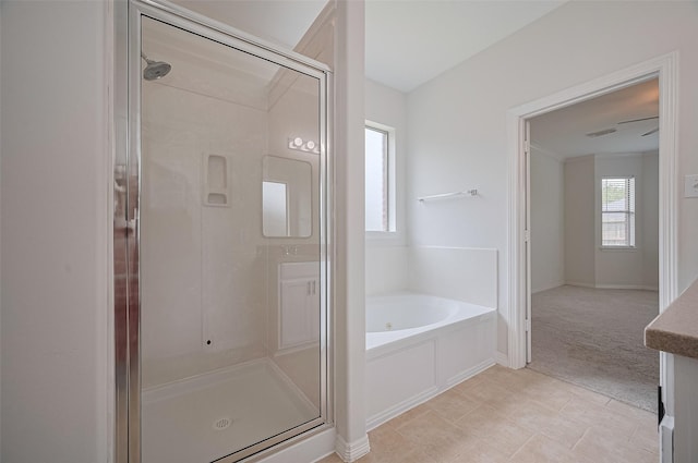 4142 Regal Stone Ln, Sugar Land, TX 77479 - full bathroom with a shower stall, a bath, tile patterned flooring, and baseboards