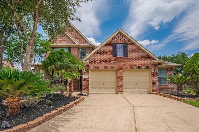 4142 Regal Stone Ln, Sugar Land, TX 77479 - traditional-style house with brick siding, driveway, and an attached garage
