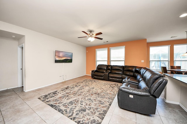 living area featuring light tile patterned floors, ceiling fan, baseboards, and recessed lighting