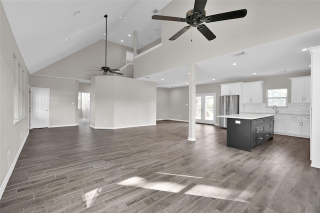 20900 Welch Rd, Richards, TX 77873 - unfurnished living room featuring ceiling fan, a sink, healthy amount of natural light, wood finished floors, and recessed lighting