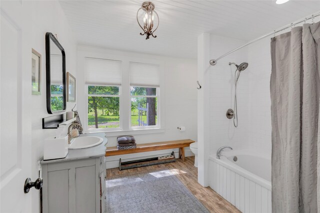 6020 State Highway 159, La Grange, TX 78945 - full bathroom with wood finished floors, toilet, vanity, and shower / tub combo with curtain