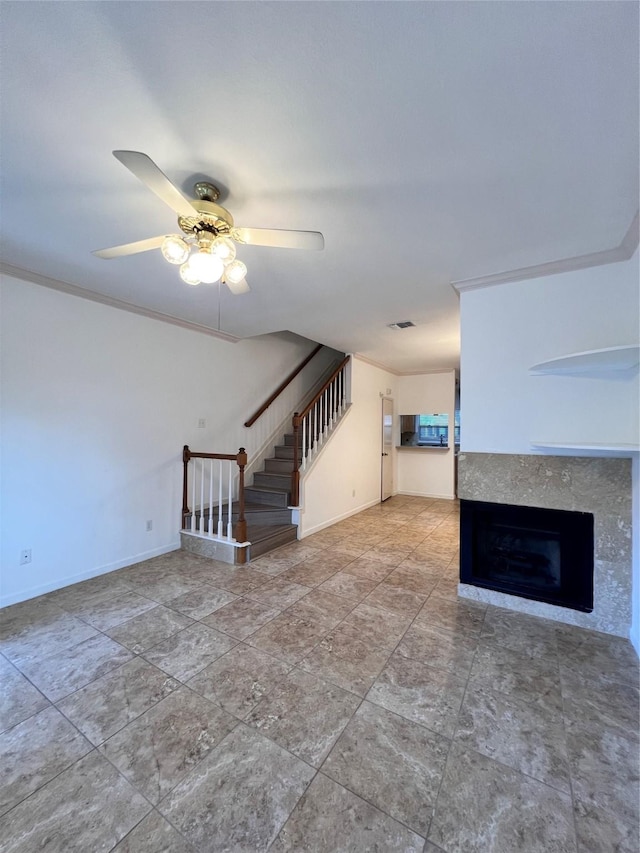 2930 Grants Lake Blvd Unit 2404, Sugar Land, TX 77479 - unfurnished living room featuring stairway, ceiling fan, a tiled fireplace, and baseboards