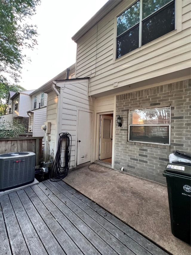 2930 Grants Lake Blvd Unit 2404, Sugar Land, TX 77479 - wooden deck featuring central air condition unit and fence