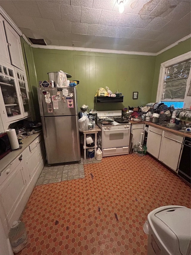 3439 5th St, Port Arthur, TX 77642 - kitchen with freestanding refrigerator, white gas range oven, crown molding, and a sink