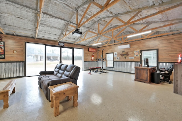 3315 Spring Branch Rd, Montgomery, TX 77316 - living room featuring high vaulted ceiling, wooden walls, healthy amount of natural light, an office area, and a wall unit AC