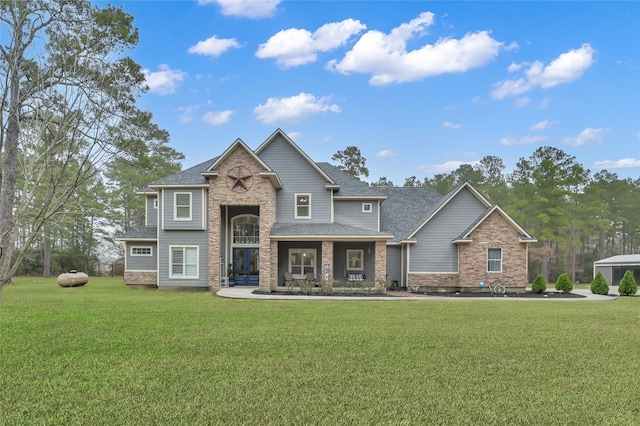 3315 Spring Branch Rd, Montgomery, TX 77316 - view of front facade with a front lawn, a shingled roof, and stone siding