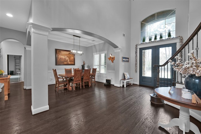 3315 Spring Branch Rd, Montgomery, TX 77316 - entrance foyer featuring dark wood finished floors, a high ceiling, decorative columns, arched walkways, and recessed lighting
