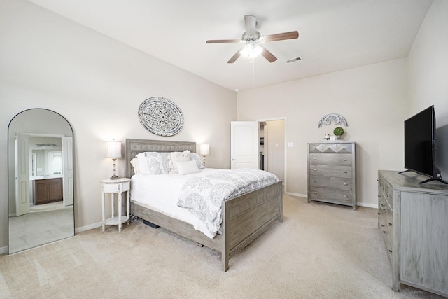 12019 Eagle Ridge Dr, Dayton, TX 77535 - bedroom with light carpet, baseboards, a ceiling fan, and connected bathroom
