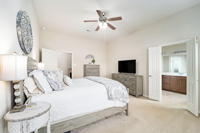 12019 Eagle Ridge Dr, Dayton, TX 77535 - bedroom featuring light colored carpet, lofted ceiling, ceiling fan, and connected bathroom