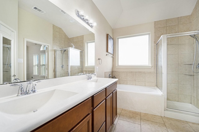 12019 Eagle Ridge Dr, Dayton, TX 77535 - full bath featuring a shower stall, lofted ceiling, tile patterned flooring, a garden tub, and double vanity