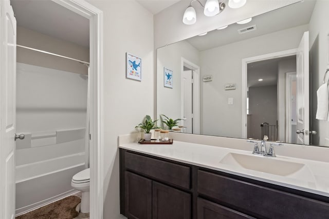 full bath featuring toilet, vanity, and bathtub / shower combination