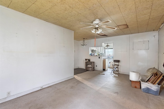 206 Shotwell St, Houston, TX 77020 - living room with ceiling fan, concrete floors, and a wood stove