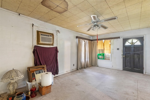 206 Shotwell St, Houston, TX 77020 - foyer featuring a wall mounted air conditioner, carpet, a ceiling fan, and baseboards