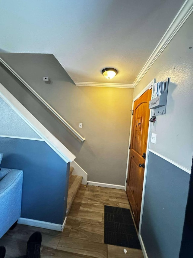 8206 Claiborne St, Houston, TX 77078 - foyer entrance featuring ornamental molding, wood finished floors, stairway, and baseboards
