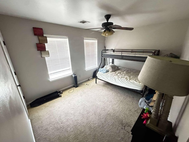 8206 Claiborne St, Houston, TX 77078 - carpeted bedroom with ceiling fan and baseboards