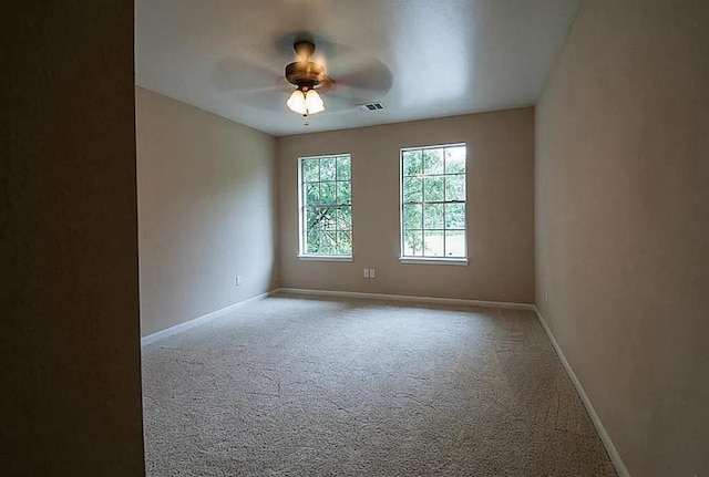 8206 Claiborne St, Houston, TX 77078 - empty room featuring carpet, baseboards, and a ceiling fan