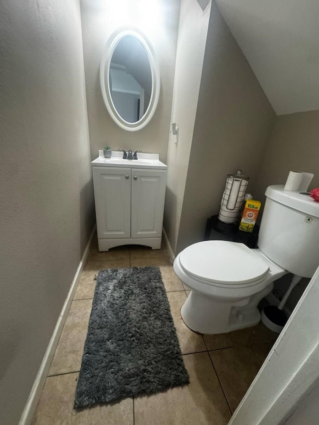 8206 Claiborne St, Houston, TX 77078 - bathroom with toilet, tile patterned floors, and vanity