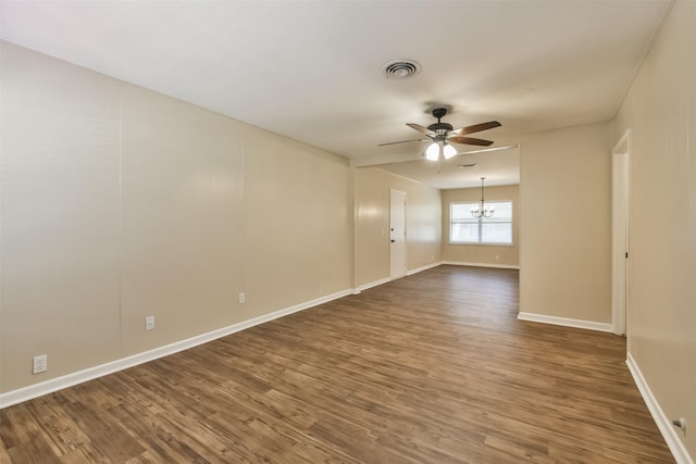 6738 Underhill St, Houston, TX 77092 - spare room featuring a ceiling fan, dark wood-type flooring, a chandelier, and baseboards