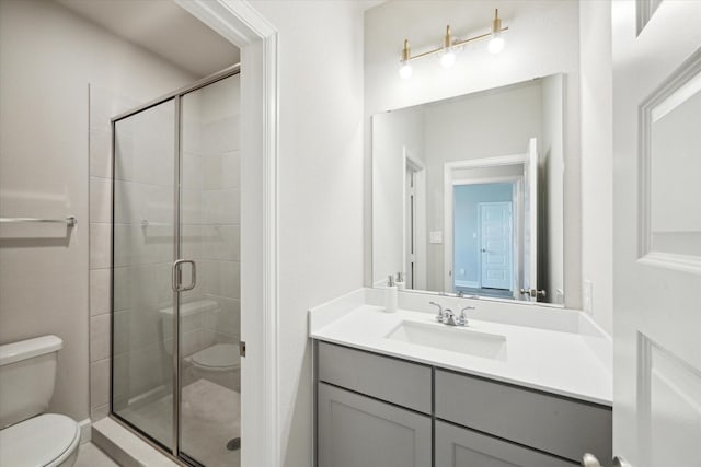 9951 Chapman Trl, Manvel, TX 77578 - bathroom featuring toilet, a shower stall, and vanity