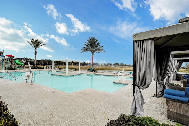 9951 Chapman Trl, Manvel, TX 77578 - community pool featuring a patio