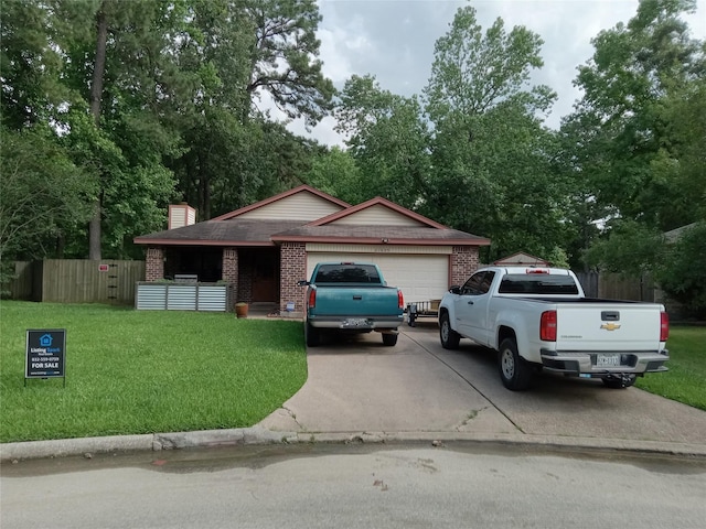 21825 Raven Tree Ct, Porter, TX 77365 - view of front of property with driveway, an attached garage, brick siding, a chimney, and view of scattered trees