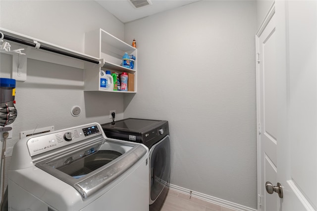 19011 Whistling Duck Dr, Cypress, TX 77433 - laundry area with independent washer and dryer and baseboards