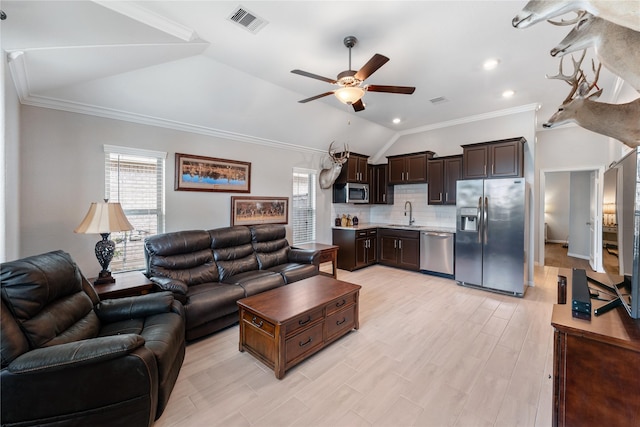 19011 Whistling Duck Dr, Cypress, TX 77433 - living area featuring a ceiling fan, vaulted ceiling, ornamental molding, and light wood finished floors