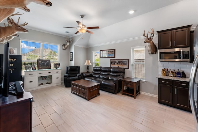 19011 Whistling Duck Dr, Cypress, TX 77433 - living area featuring ceiling fan, lofted ceiling, baseboards, and crown molding