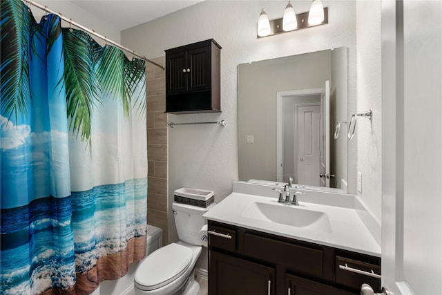 19011 Whistling Duck Dr, Cypress, TX 77433 - bathroom with vanity, toilet, a textured wall, and shower / tub combo with curtain