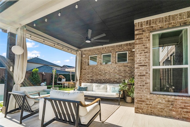 8811 Sandhill Crane Rd, Baytown, TX 77521 - view of patio / terrace with an outdoor living space, ceiling fan, and fence