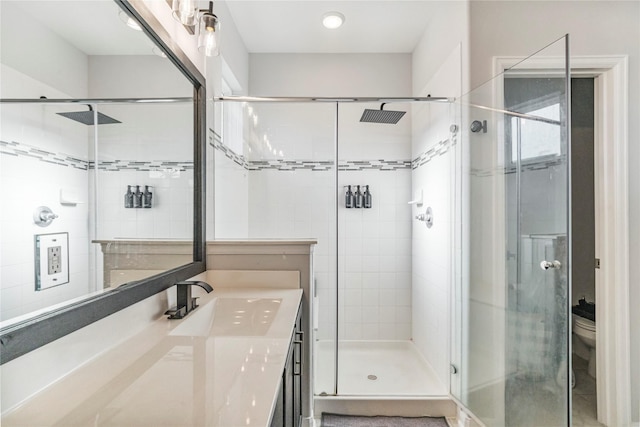 8811 Sandhill Crane Rd, Baytown, TX 77521 - full bathroom featuring a stall shower, vanity, and toilet