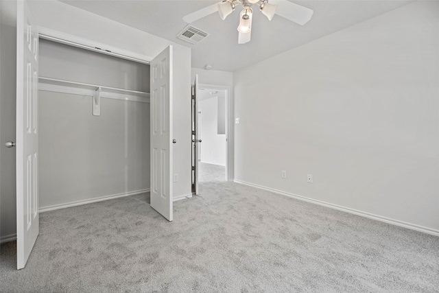 unfurnished bedroom featuring carpet flooring, a closet, ceiling fan, and baseboards