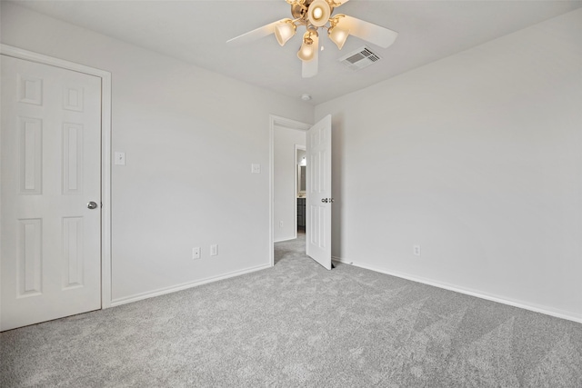 unfurnished bedroom with carpet, baseboards, and ceiling fan