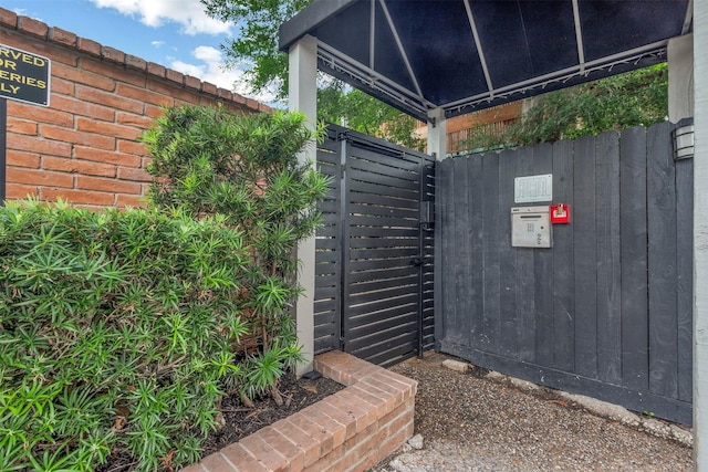 gate featuring a gazebo and fence