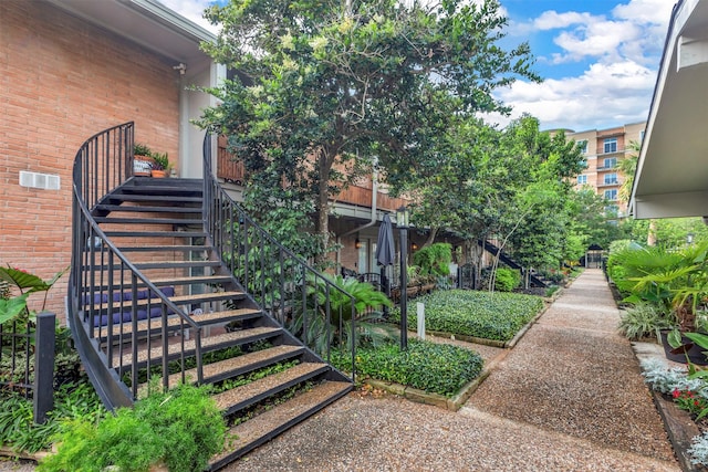 view of exterior entry featuring brick siding