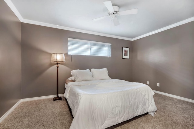 bedroom featuring carpet floors, crown molding, baseboards, and a ceiling fan