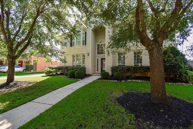 5530 Riverstone Crossing Dr, Sugar Land, TX 77479 - view of front of house with a front yard and stucco siding