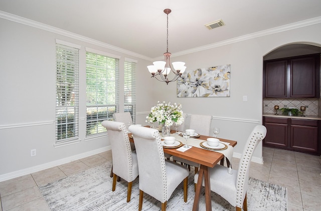 5530 Riverstone Crossing Dr, Sugar Land, TX 77479 - dining space with light tile patterned floors, a chandelier, ornamental molding, and baseboards