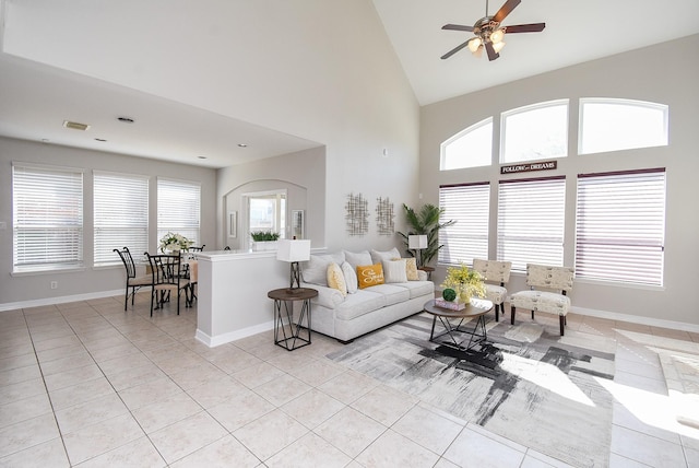 5530 Riverstone Crossing Dr, Sugar Land, TX 77479 - living room with light tile patterned flooring, a ceiling fan, high vaulted ceiling, and baseboards