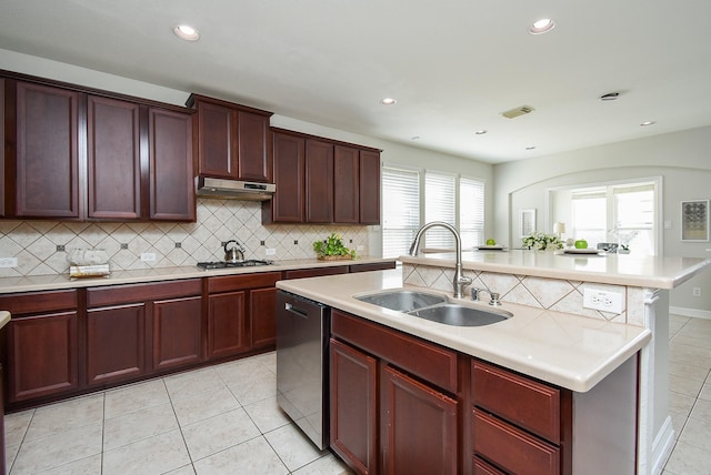 5530 Riverstone Crossing Dr, Sugar Land, TX 77479 - kitchen with a sink, appliances with stainless steel finishes, backsplash, light tile patterned floors, and light countertops
