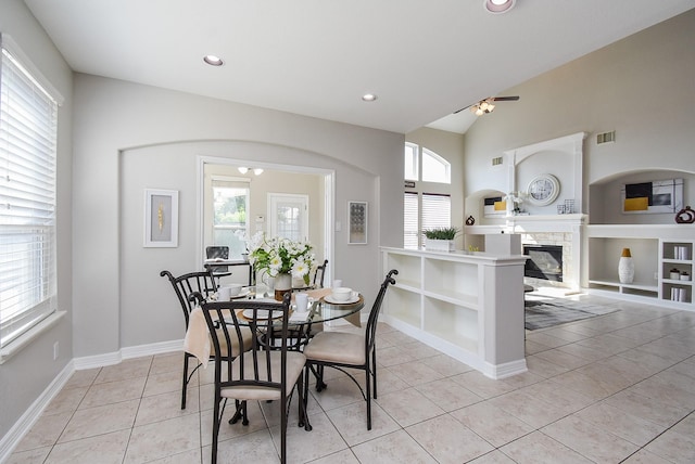 5530 Riverstone Crossing Dr, Sugar Land, TX 77479 - dining space with healthy amount of natural light, light tile patterned floors, built in features, a ceiling fan, and recessed lighting