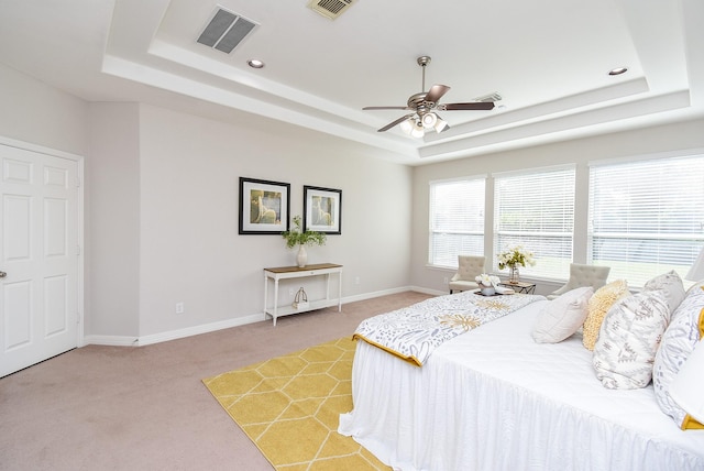 5530 Riverstone Crossing Dr, Sugar Land, TX 77479 - bedroom with a raised ceiling, light carpet, baseboards, recessed lighting, and ceiling fan