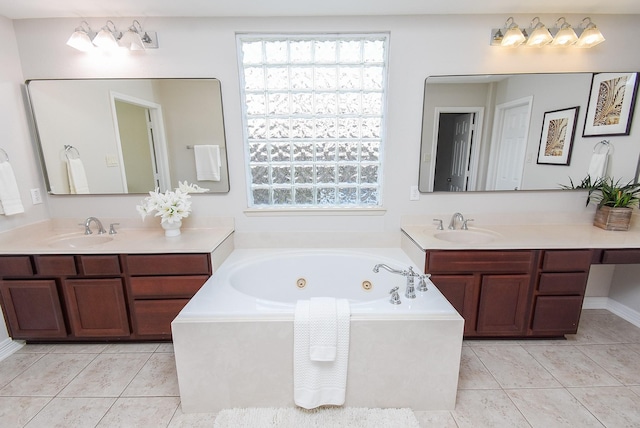5530 Riverstone Crossing Dr, Sugar Land, TX 77479 - full bath with tile patterned floors, a jetted tub, and two vanities