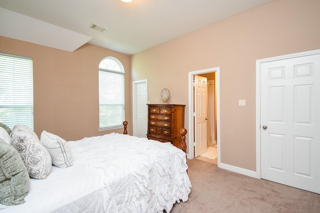 5530 Riverstone Crossing Dr, Sugar Land, TX 77479 - bedroom featuring light colored carpet, baseboards, and ensuite bath