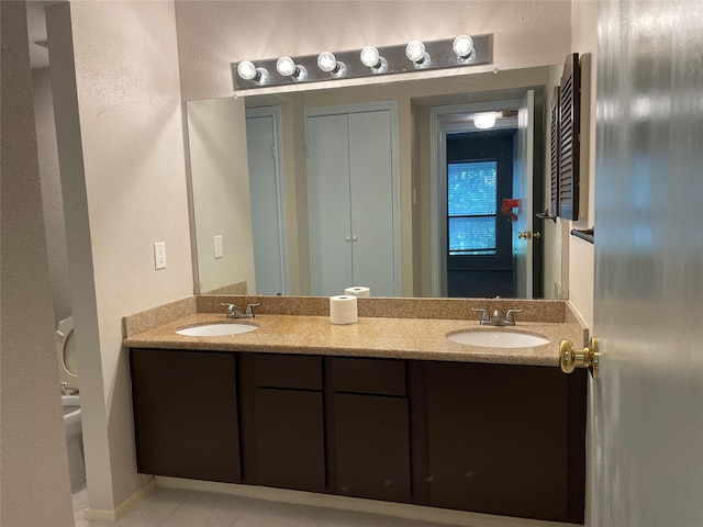 7950 N Stadium Dr Unit 210, Houston, TX 77030 - full bathroom featuring double vanity and tile patterned flooring