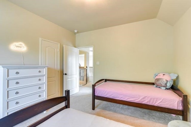 bedroom featuring light colored carpet