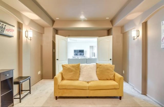living area featuring light colored carpet