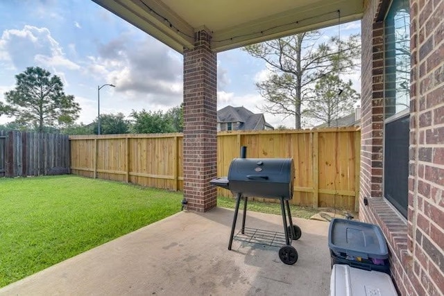 view of patio featuring a grill